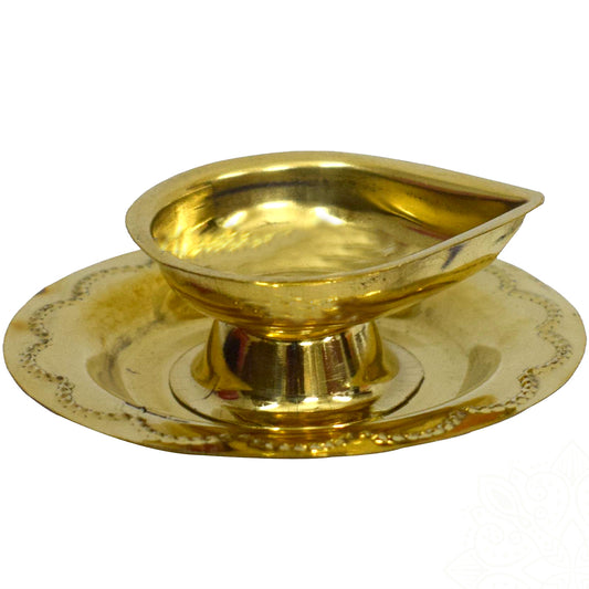 Aarti plate with agal deepam slight left front view single oil lamp on pedestal with engraved round tray on white background