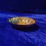 Agarbathi stand plate scalloped design slight side angle view placed on blue velvet for incense pooja