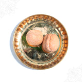Akhrot whole nuts in straight top view placed on a decorative plate showing textured shells for daily pooja use