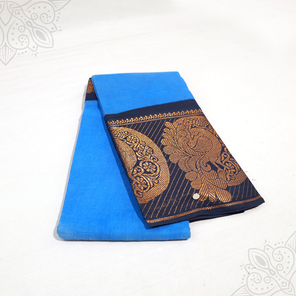 Amman saree cotton with 9 inch navy zari border, blue body folded neatly, slight side angle view on white background