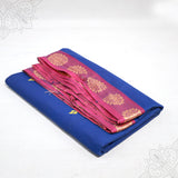 Blue pure cotton amman saree with pink pink zari border, folded neatly, side angle view for pooja and daily wear