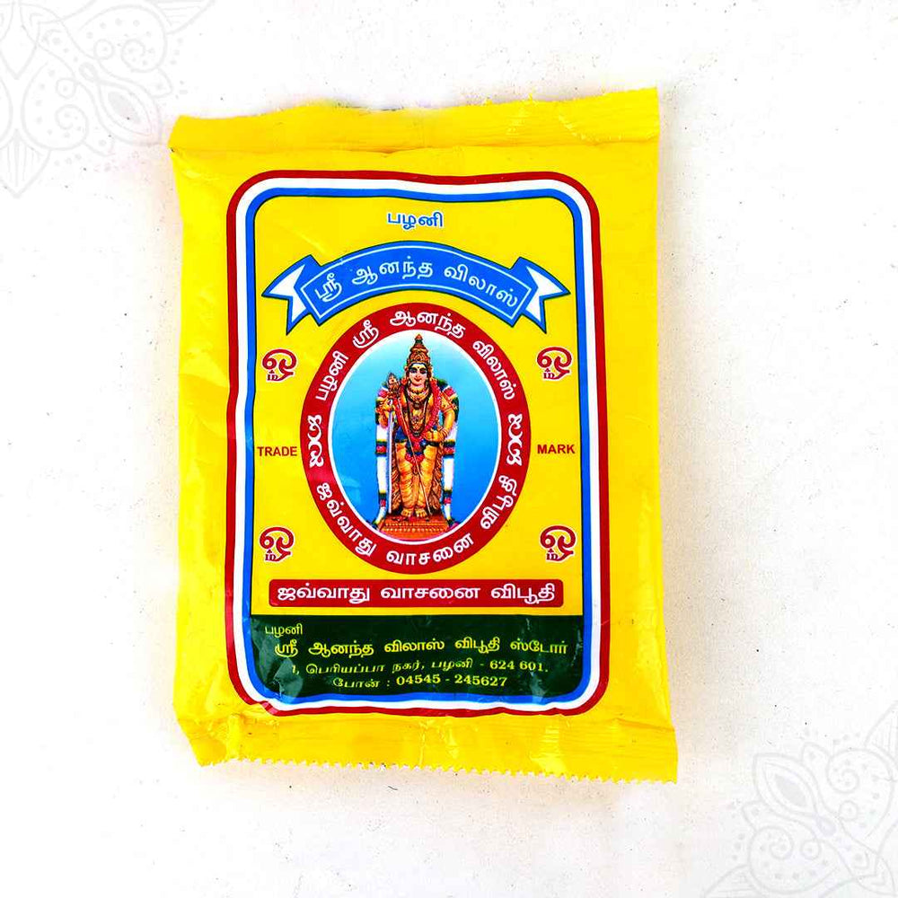 Anantha Vilas vibhuti pack in a slight right side angle view showing the yellow cover with Murugan design for pooja use