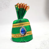 Green cloth turban with blue stone design and golden border straight front view for deity decoration