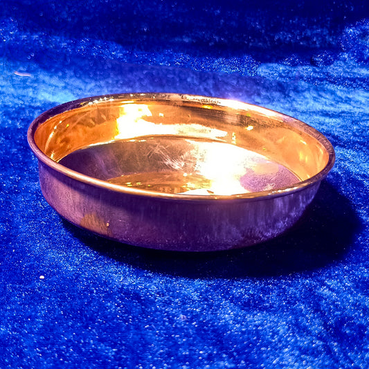 Copper Harivan plate with traditional detailing shown in a straight top view for pooja use.