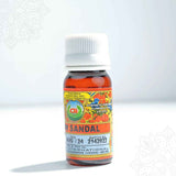 Essence sandal pooja fragrance oil in a small amber bottle with white cap and floral label, straight front view on white background