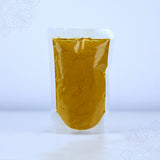 Kasthuri manjal powder 50g in a clear sealed pouch showing golden yellow turmeric powder in a straight front view against a white backdrop.
