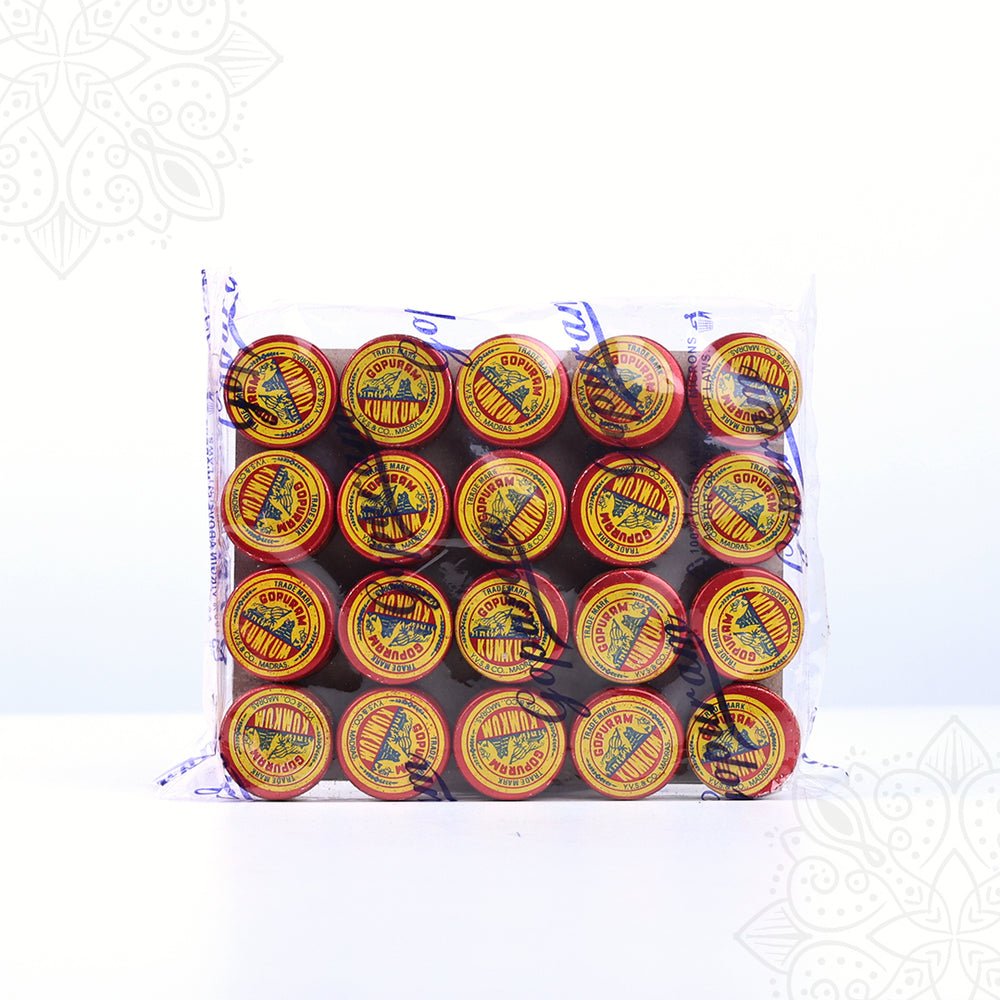 Kumkum powder tins pack Gopuram brand front view showing red and yellow round containers neatly arranged