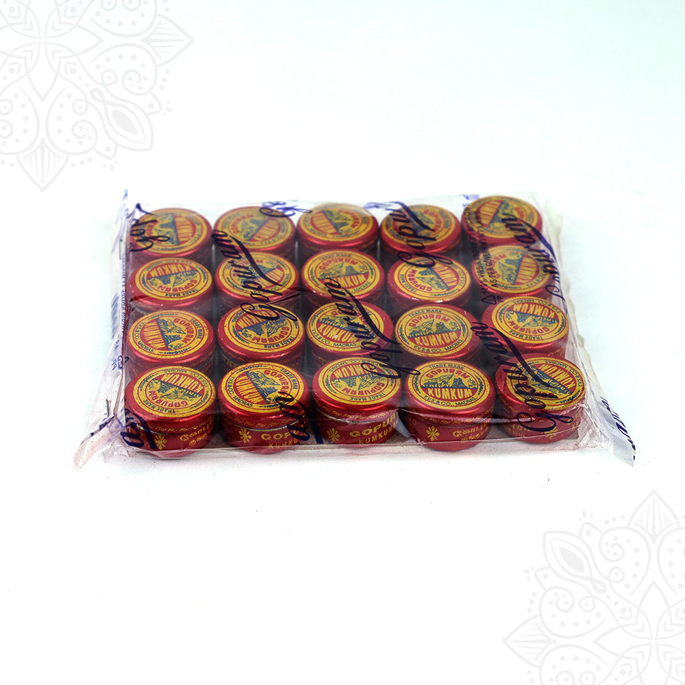 Kumkum powder tins pack Gopuram brand angled top view showing sacred red tilak containers closely