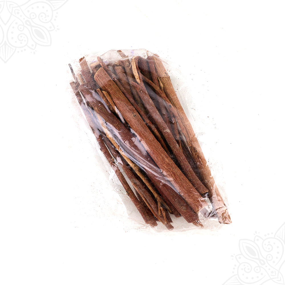 Purasu samithu sticks bundled in a clear plastic pack shown in a diagonal flat lay view against a white background