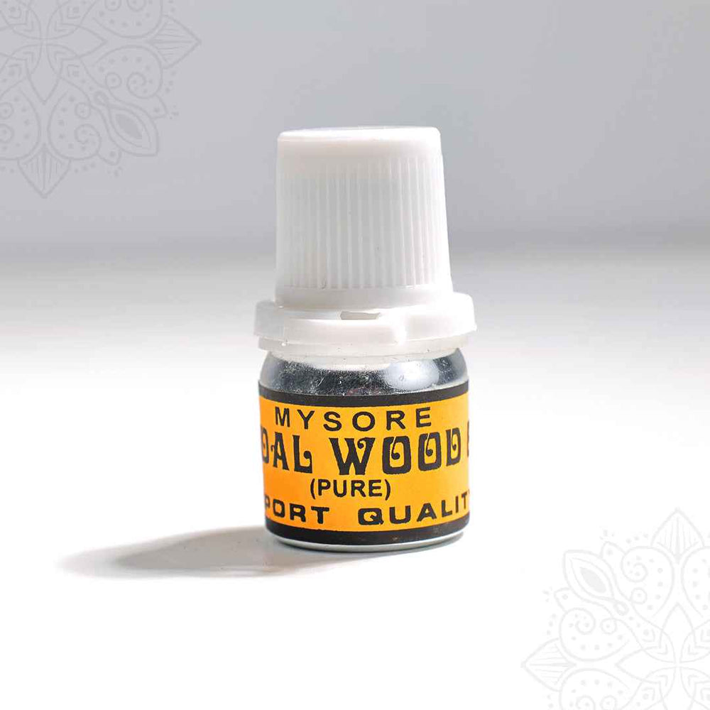 Pure sandal oil Mysore sandalwood bottle slight right angle view with white cap for daily pooja use