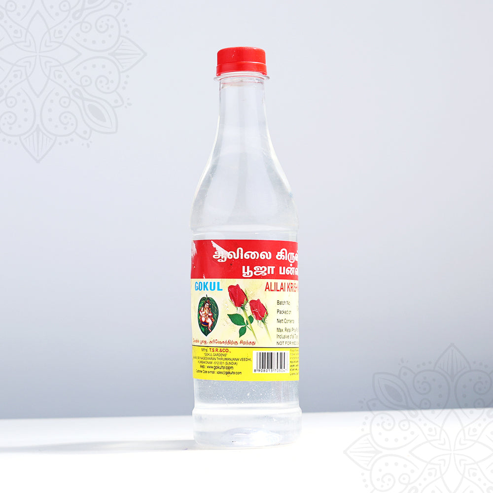 Gokul rose water large puja bottle in a front-facing view showing Tamil label with red rose print and red cap against a grey background