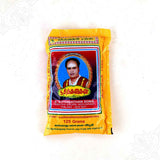 Sithanathan vibhuti pack 125 grams in straight front facing view showing founder photo on yellow cover for pooja rituals