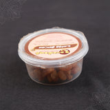 Subamangalam dry grapes pack slight top angle view showing raisins inside clear container