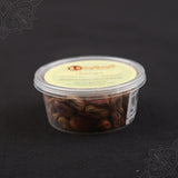 Subamangalam pista pack side angle view showing pistachios clearly through clear container