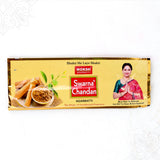 Top view of Moksh Swarna Chandan agarbatti pack with sandalwood print on gold foil pack on white surface