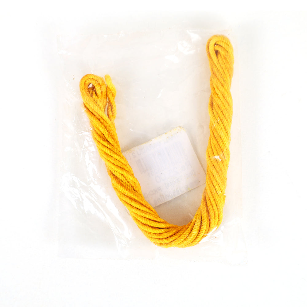 Handmade thali saradu two line yellow twisted rope folded in a U shape with a label card packed in clear cover in a flat lay top-down view