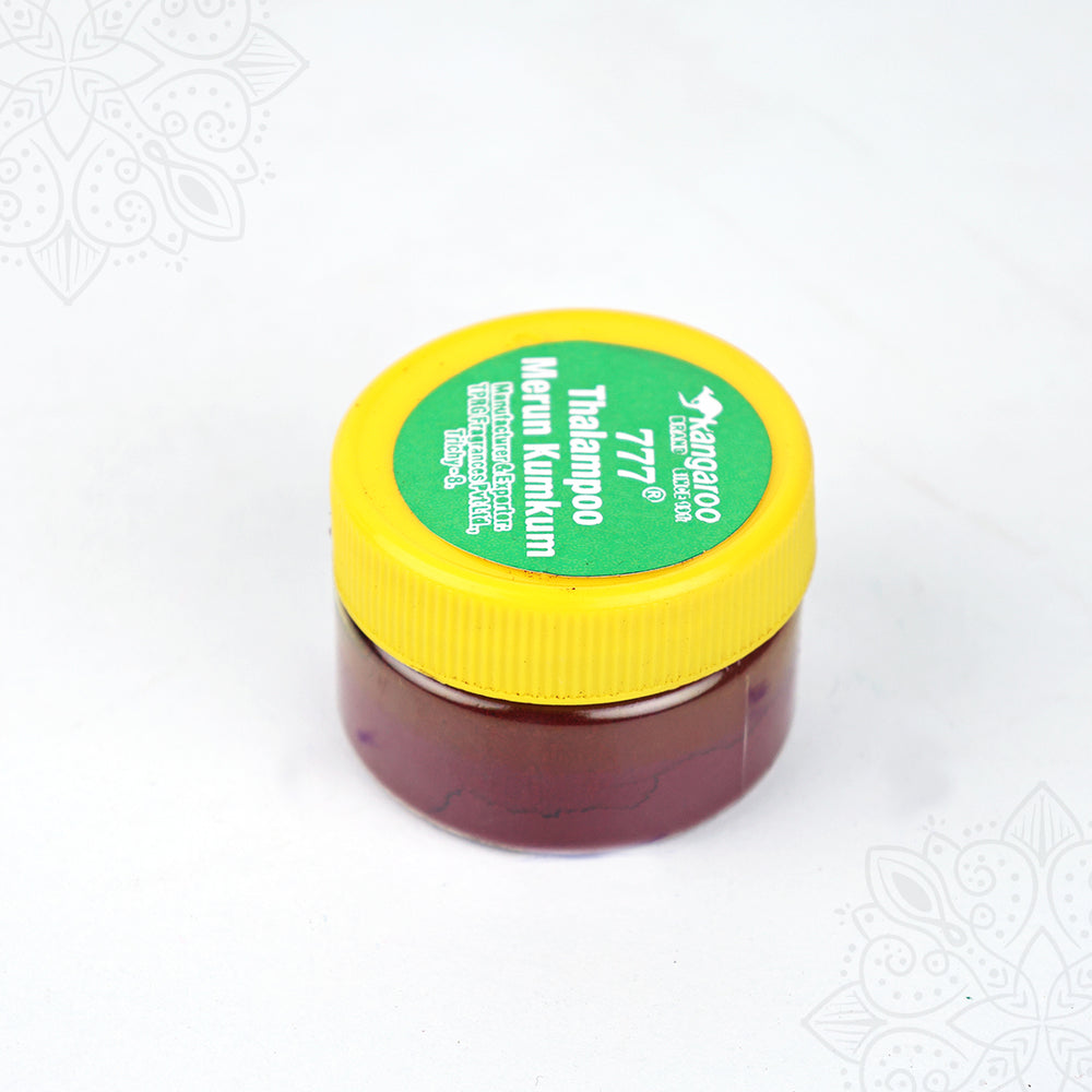 Thazhampoo kumkum box jar top angle view showing green label and yellow lid for daily pooja application