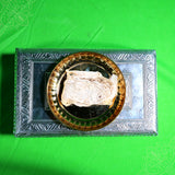 Vazhai thandu thiri wick folded piece placed in metal urli plate top view for daily pooja