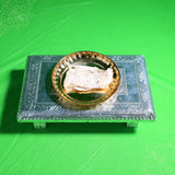 Vazhai thandu thiri wick in metal plate kept on silver stool slight top angle for pooja use