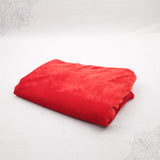 Red velvet cloth 1 meter folded neatly on white background side angle view for pooja decoration