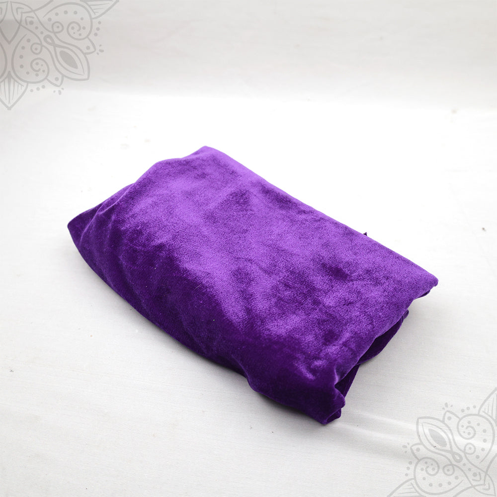 Violet velvet cloth 1 meter folded neatly on white background side angle view for pooja decoration