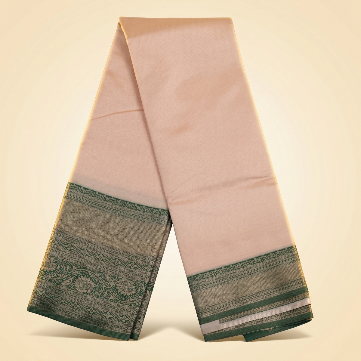 Amman soft silk saree 6 inch border in peach with green floral woven border, draped straight front view.