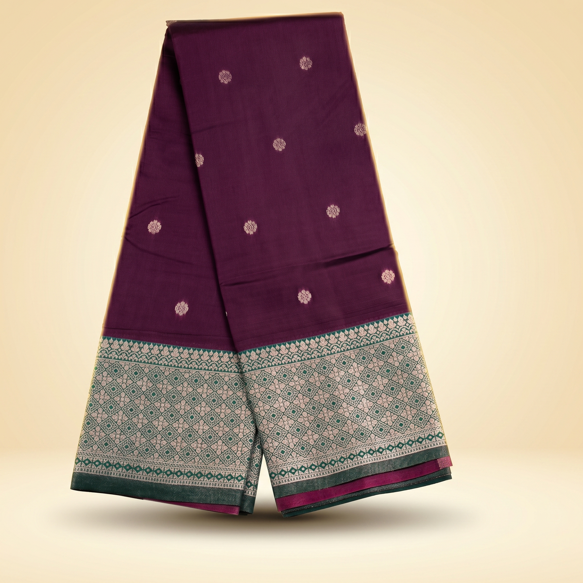 Amman soft silk saree 6 inch border in wine purple with small motifs and green woven border, draped straight front view.