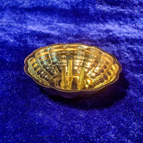 Agarbathi stand plate with shell shape design top angle view kept on blue cloth for pooja incense use