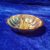 Agarbathi stand plate shell shape with multiple holders front angle view on blue velvet for pooja decor
