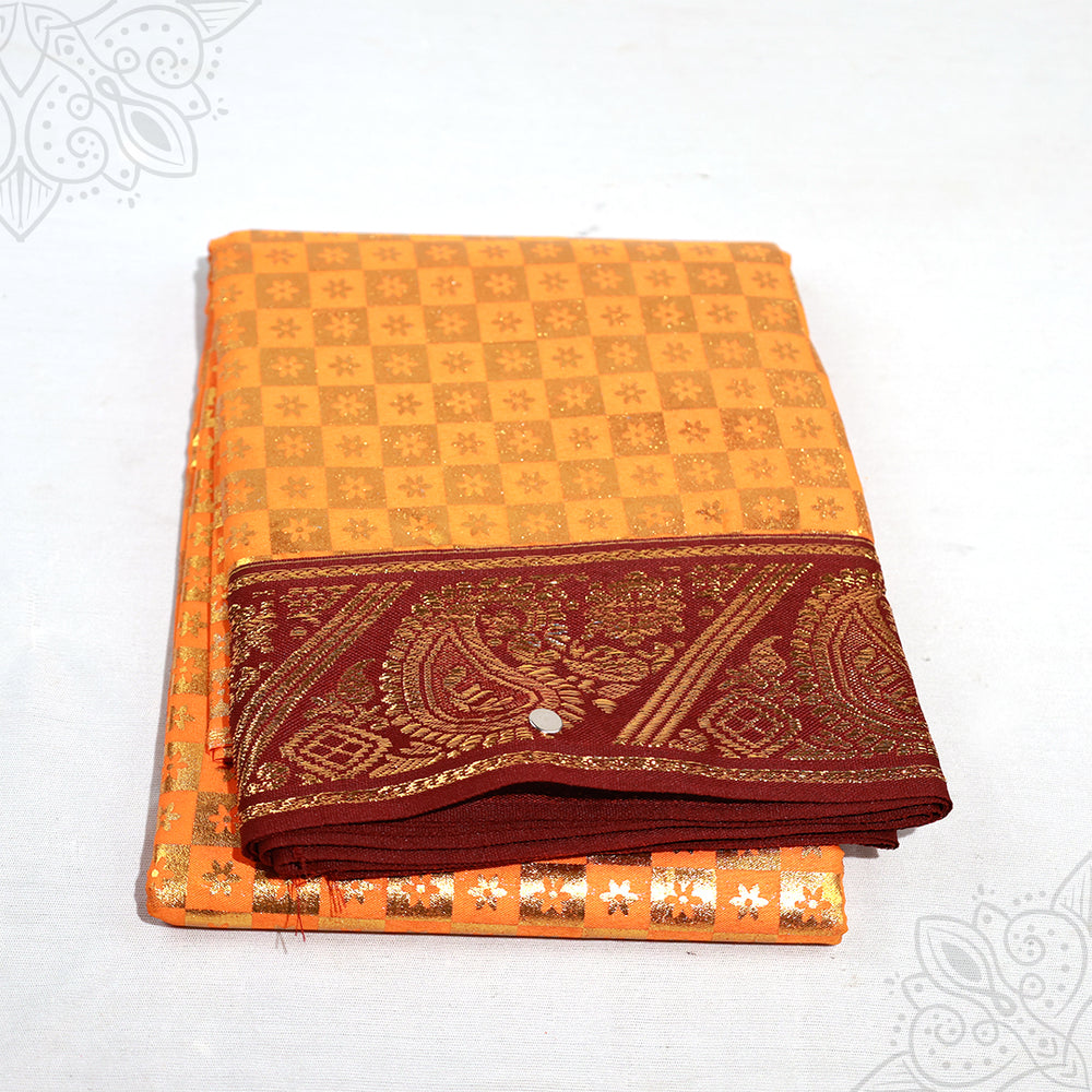 Dark yellow Amman saree 5mtr with maroon gold zari border and checkered pattern shown folded in slight top angled view against white surface.