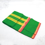 Slight top angle view of green amman saree 6 gajan with yellow stripe and pink gold border on white surface
