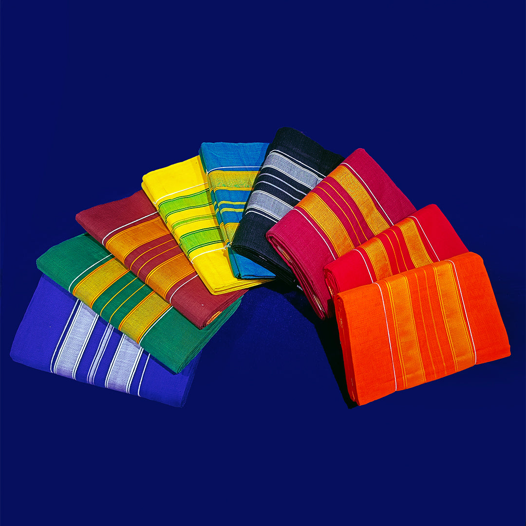 Top view of multiple amman saree 9 gajan folded in assorted colors with stripe border arranged on blue surface
