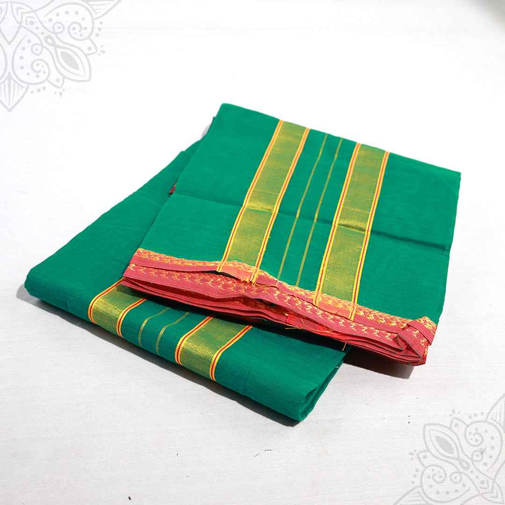 Slight top angle view of light green Amman saree 9 gajan with gold stripe and red border on white surface

