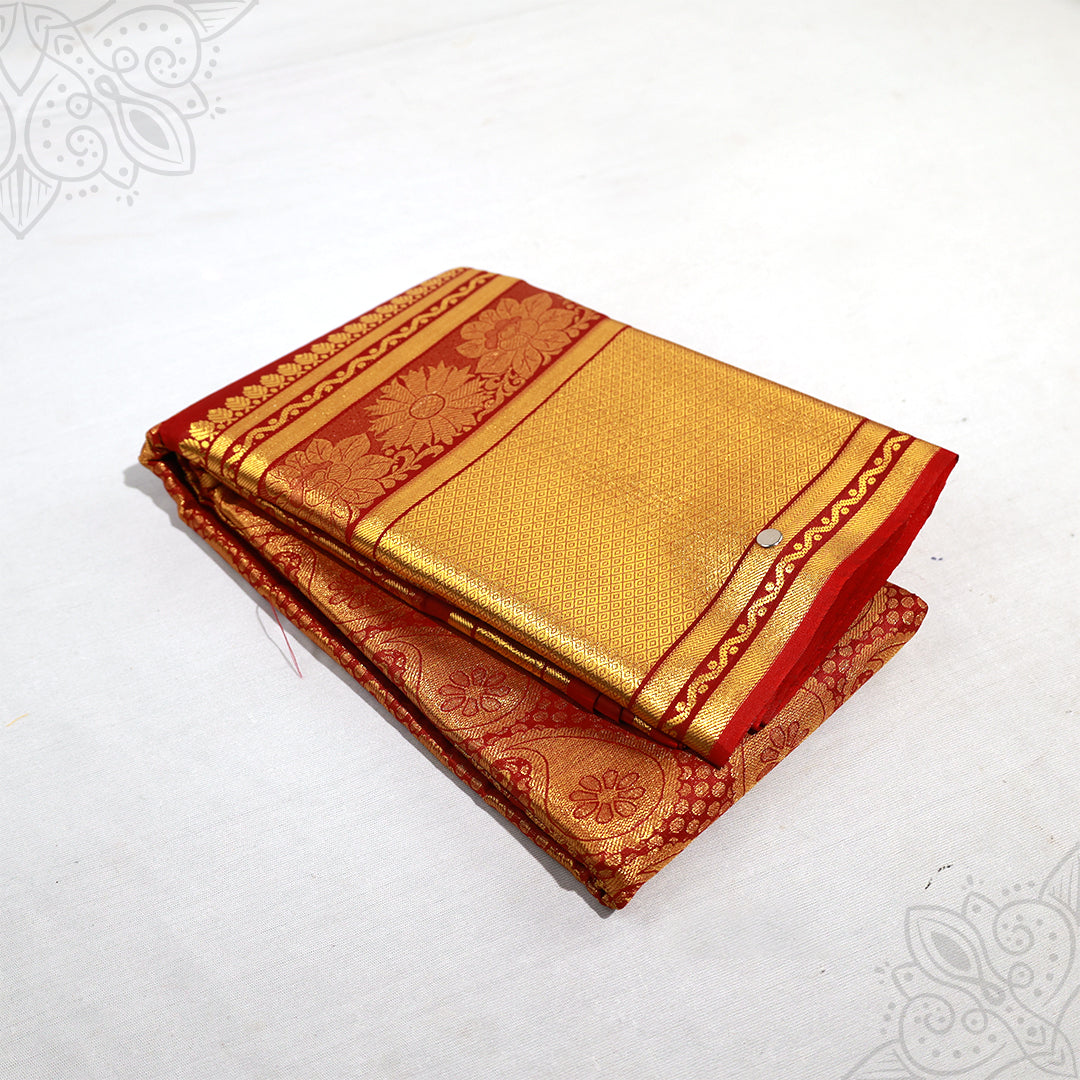 Meroon amman saree with big gold jacquard floral border folded neatly side angle view for pooja and festive wear