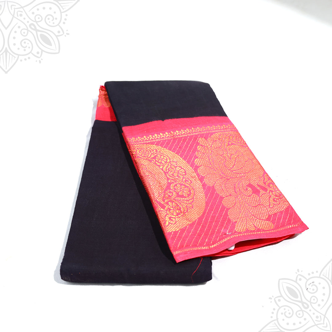 Amman saree cotton with 9 inch pink zari border, navy blue body folded neatly, slight side angle view on white background
