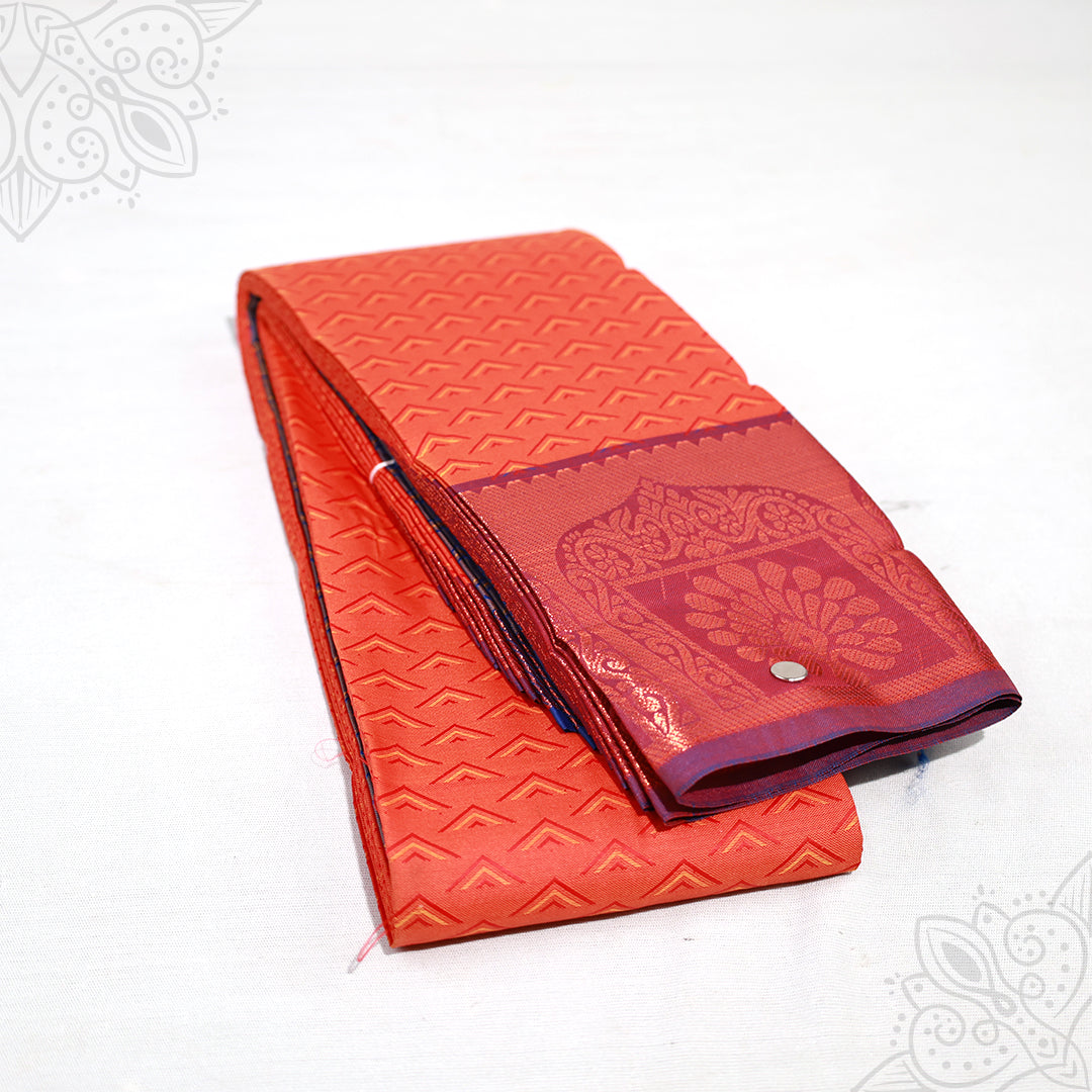 Amman saree embose orange-red with peacock motif border folded view for goddess idol decoration