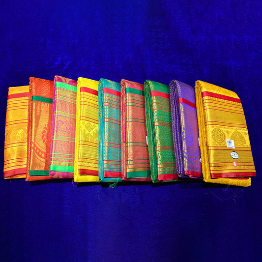 Top view of amman saree kottanji in red, rose, orange, yellow, violet and green with gold zari print on blue surface
