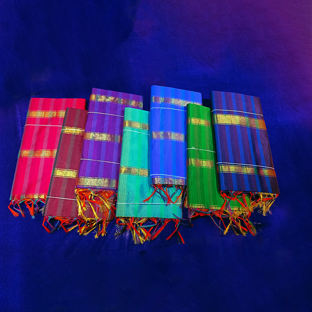 Front view of Amman saree multicoloured checked in rose, meroon, violet, light green, dark green, light blue, and dark blue with a gold stripe on a blue surface
