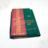 Green amman saree pure cotton with pink and gold medium border folded neatly side angle view for daily pooja wear