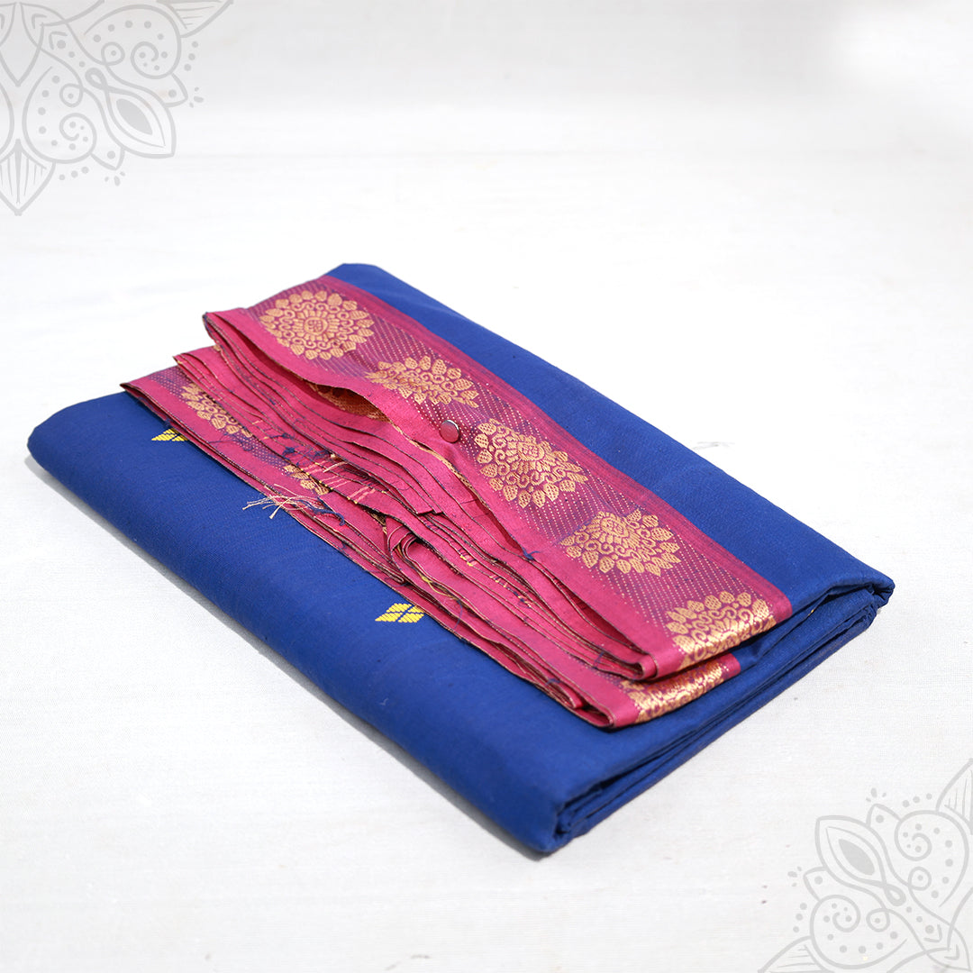 Blue pure cotton amman saree with pink pink zari border, folded neatly, side angle view for pooja and daily wear