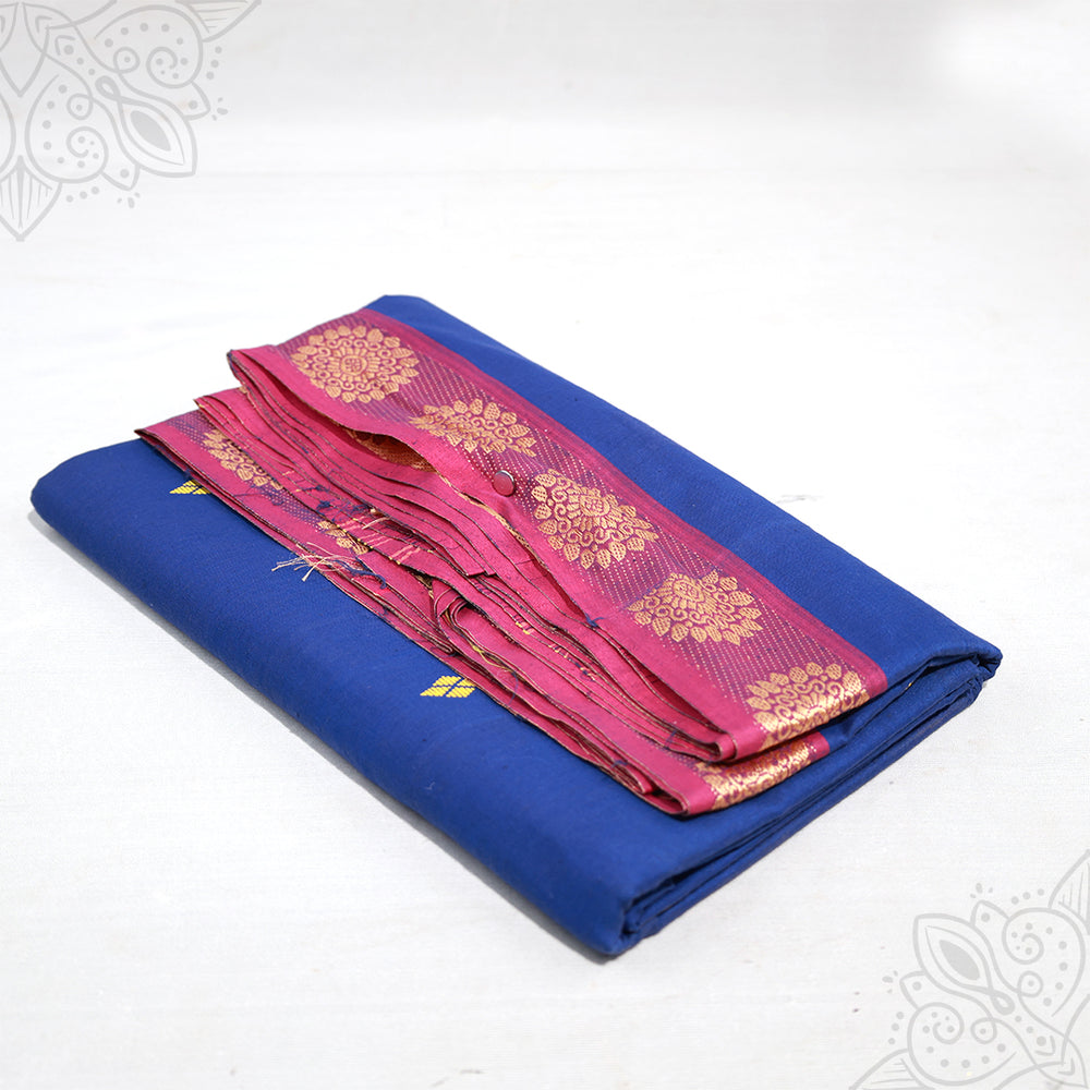 Blue pure cotton amman saree with pink pink zari border, folded neatly, side angle view for pooja and daily wear