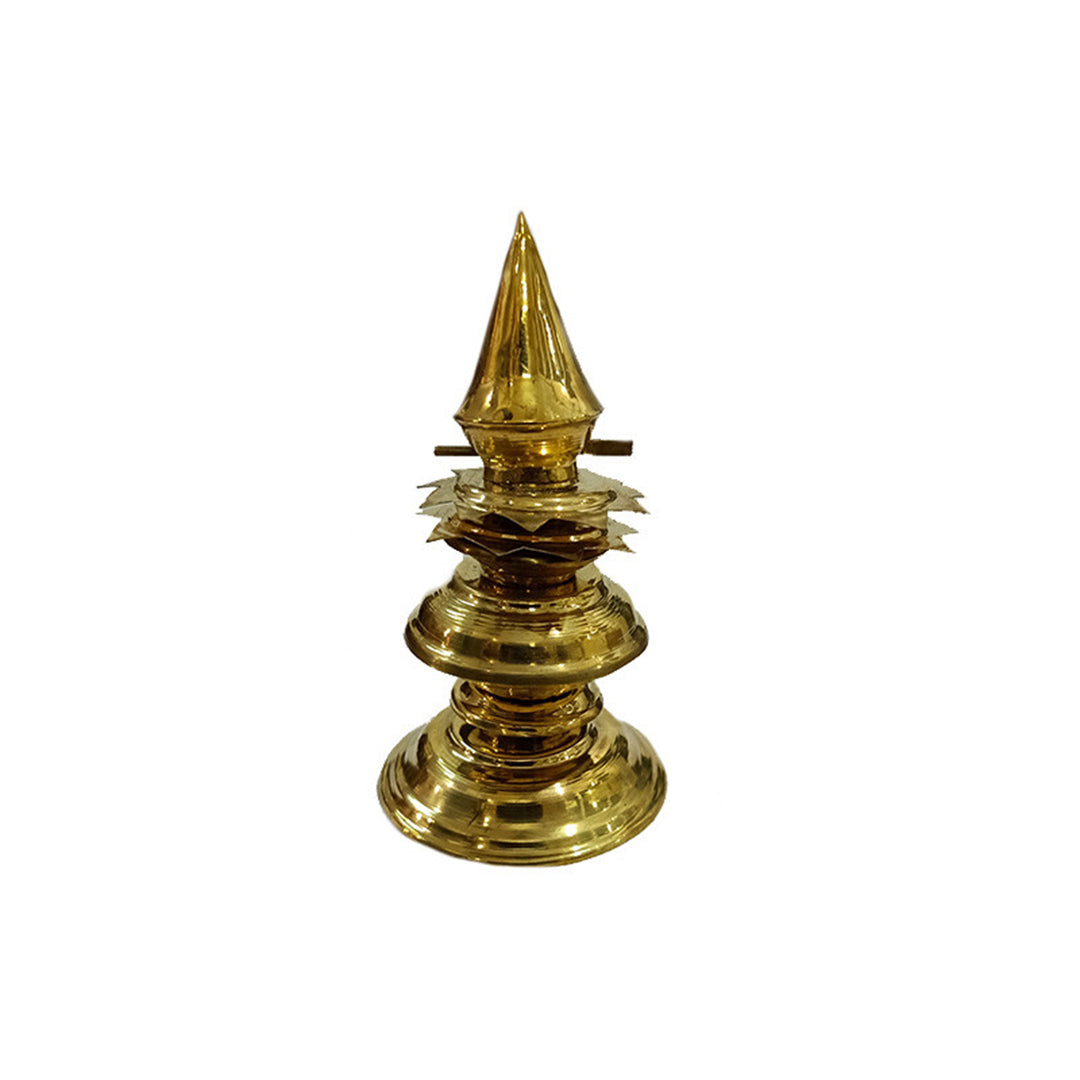 Brass kalasam in a straight front-facing slightly higher angle view showing petal disc layer more clearly with pointed top and circular base