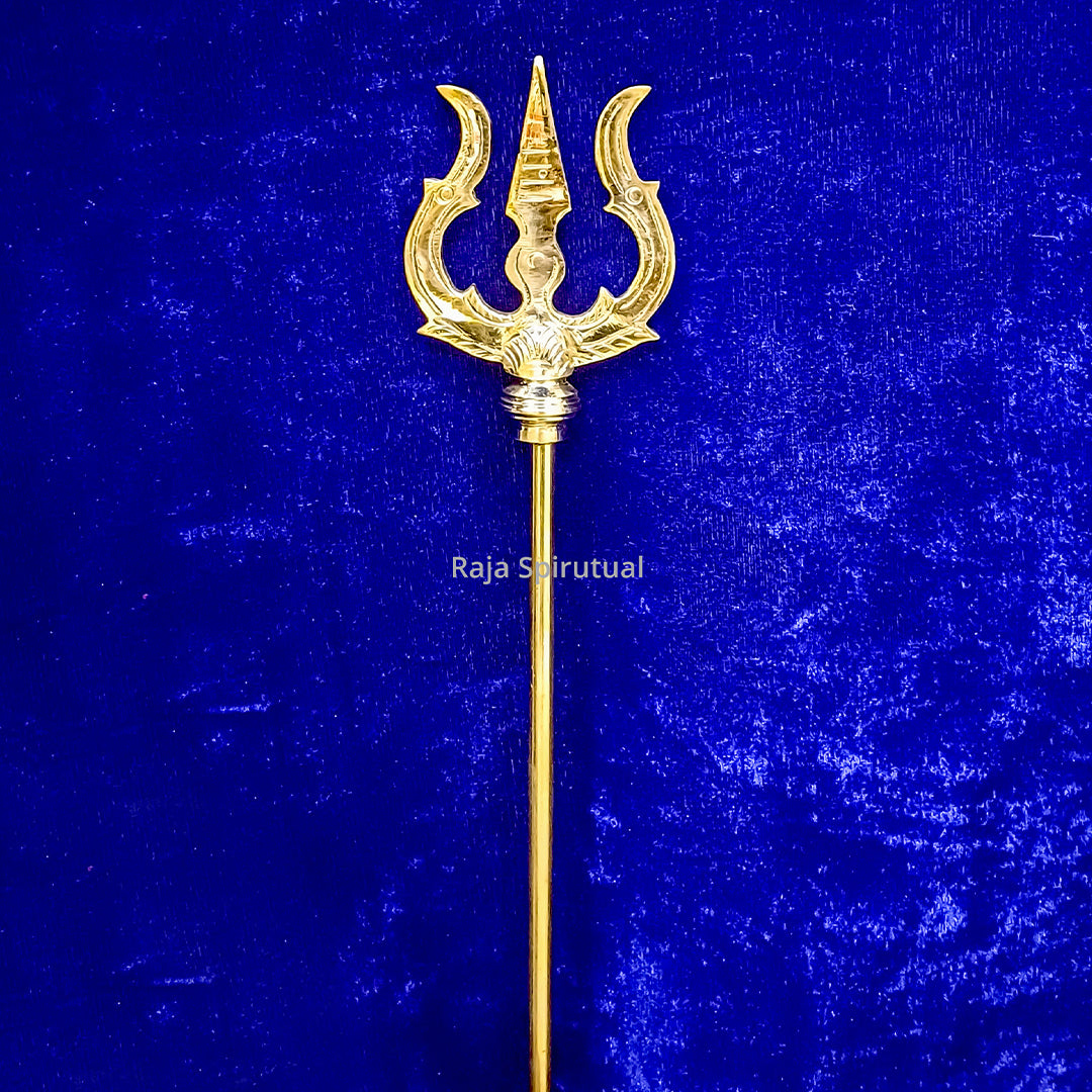 Front view of brass pattai sulam 4ft with golden trishul head and long handle against blue surface
