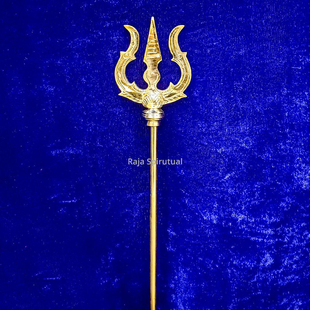 Front view of brass pattai sulam 7ft with golden trishul head and long handle against blue surface
