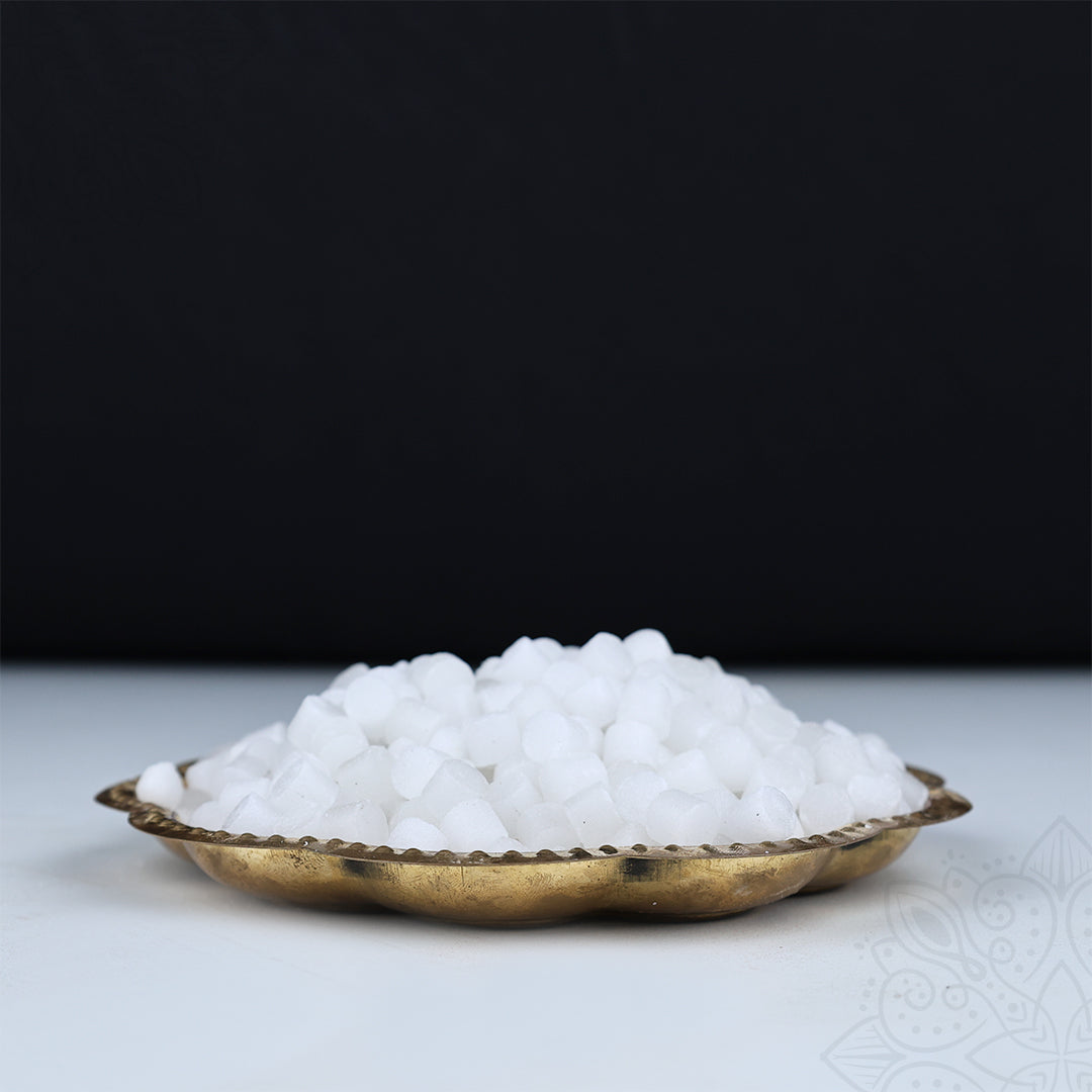 Camphor blocks heap in decorative plate slight top angle view showing pure white pooja kapoor closely