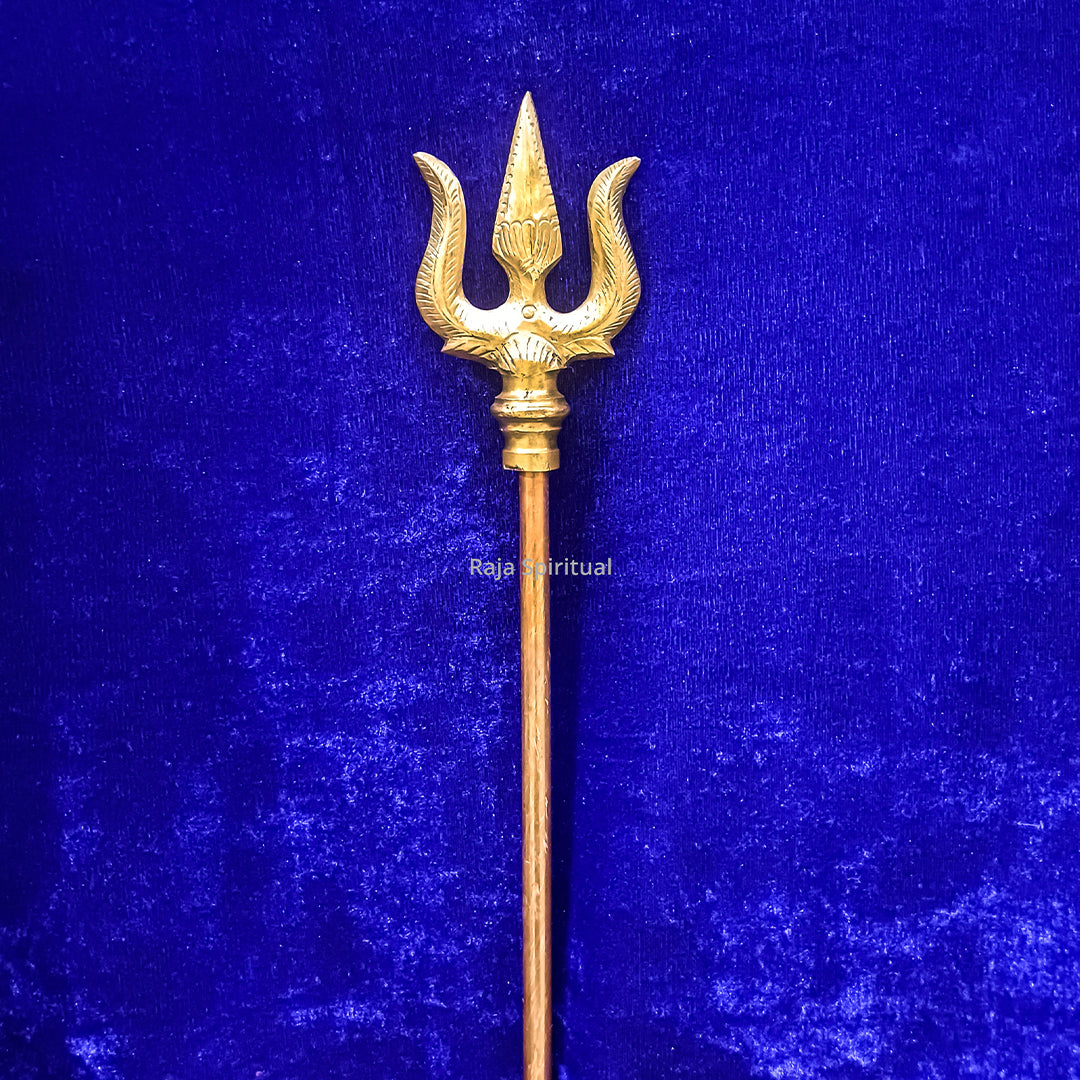 Copper muppattai sulam trident with carved leaf design front close view on blue velvet for pooja use