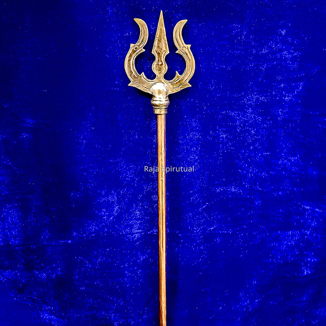 Copper pattai sulam trishul with leaf detail at knob joint and long copper handle on blue velvet background, straight front view