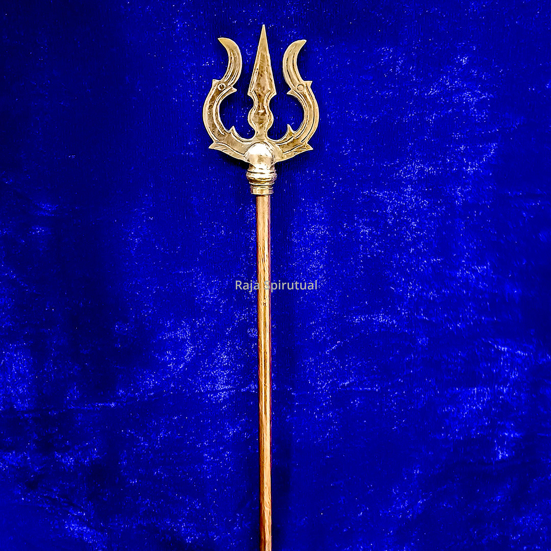 Copper pattai sulam trishul with simple curved prongs and slim copper handle on blue velvet background, straight front view