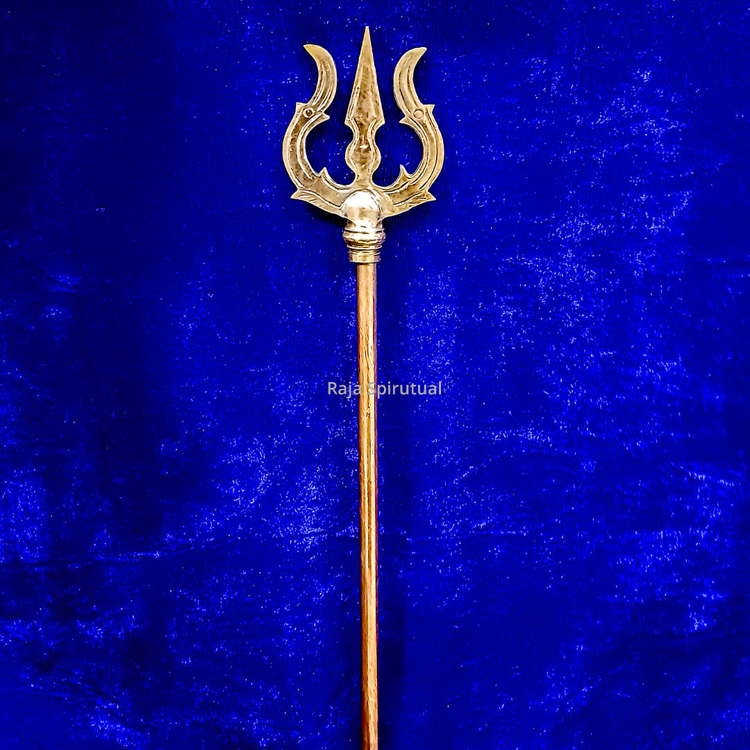 Copper pattai sulam trishul with inward-hooked prong tips and round knob on copper handle on blue velvet background, straight front view