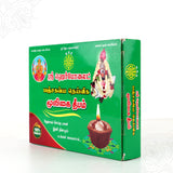 Herbolite mooligai deepam green box slight right side angle view showing lit lamp for daily home pooja
